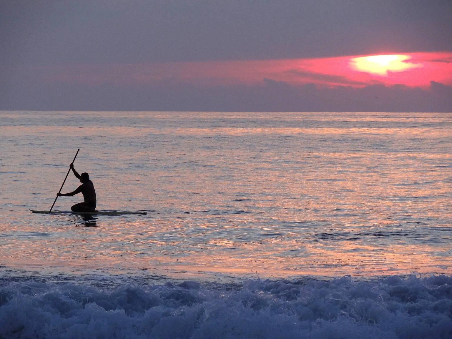 A paddler at sunset off Zicatela Beach, Puerto Escondido